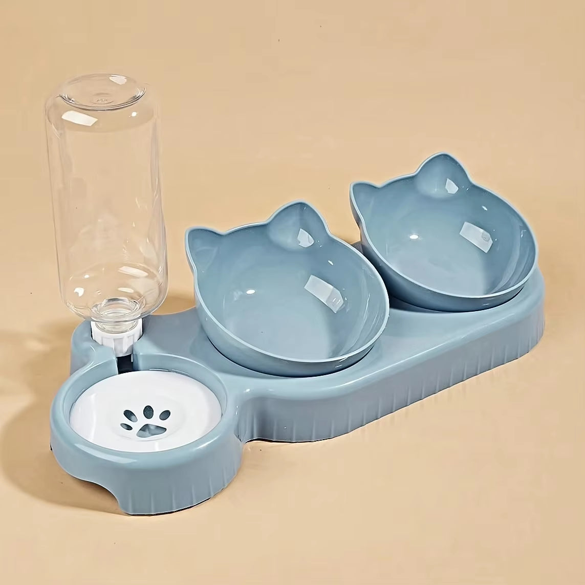 Gamelle 2 en 1 en forme de tête de chat coloris bleu avec fontaine à eau intégrée et bouteille distributrice, vue de trois quarts.